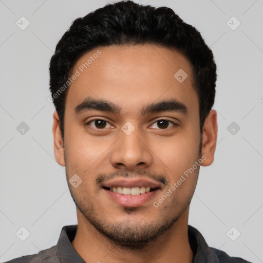 Joyful latino young-adult male with short  black hair and brown eyes