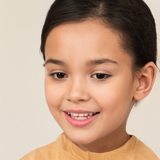 Joyful white child female with short  brown hair and brown eyes