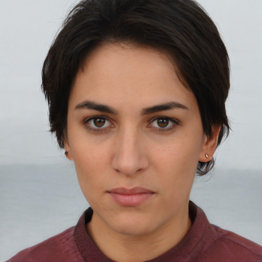 Neutral white young-adult female with short  brown hair and brown eyes