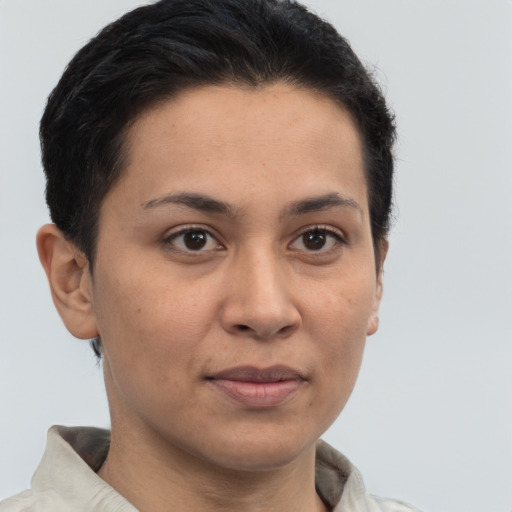 Joyful latino young-adult female with short  brown hair and brown eyes