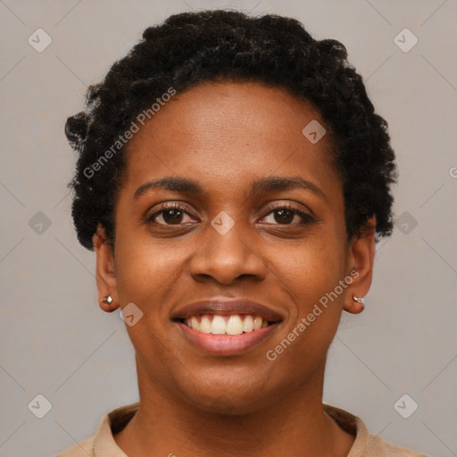 Joyful black young-adult female with short  black hair and brown eyes