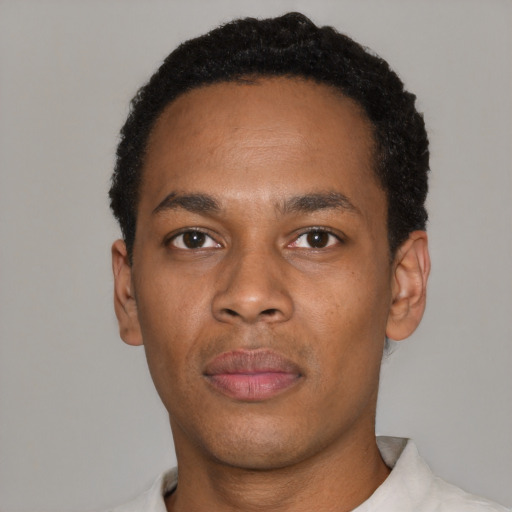 Neutral black young-adult male with short  black hair and brown eyes
