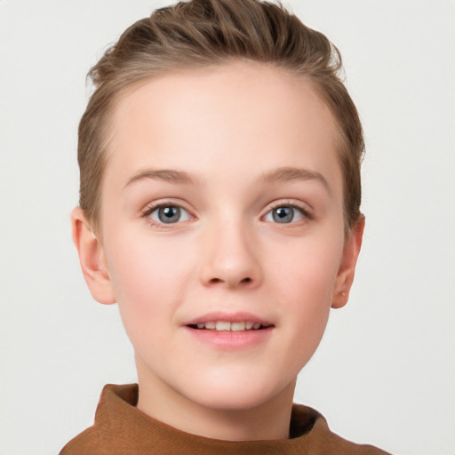 Joyful white child female with short  brown hair and grey eyes