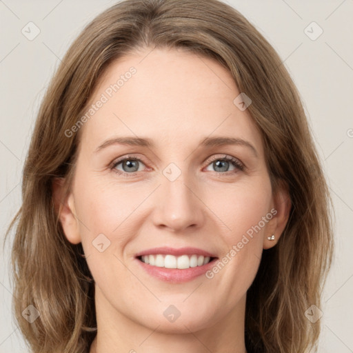 Joyful white young-adult female with medium  brown hair and grey eyes