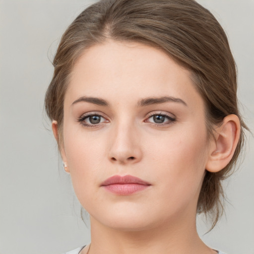 Neutral white young-adult female with medium  brown hair and grey eyes