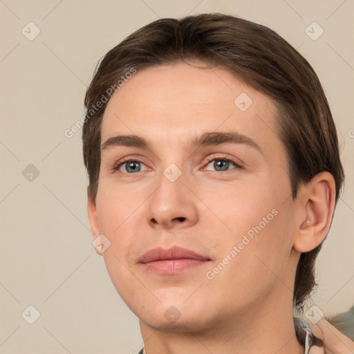 Joyful white young-adult male with short  brown hair and brown eyes