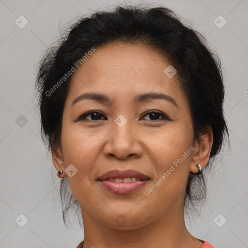 Joyful asian adult female with medium  brown hair and brown eyes