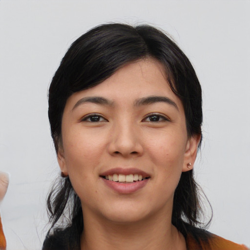 Joyful asian young-adult female with medium  black hair and brown eyes