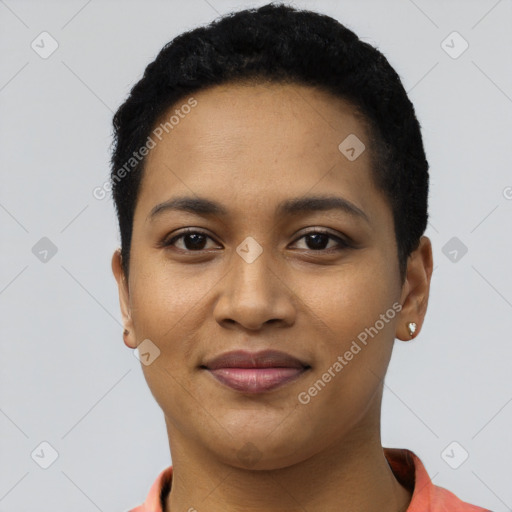 Joyful latino young-adult female with short  black hair and brown eyes