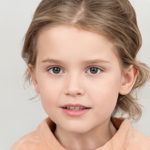 Joyful white child female with medium  brown hair and grey eyes