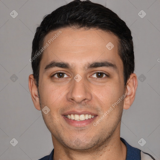 Joyful white young-adult male with short  black hair and brown eyes