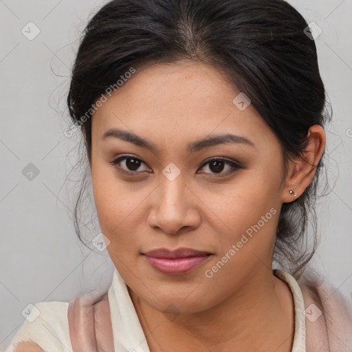 Joyful latino young-adult female with medium  brown hair and brown eyes