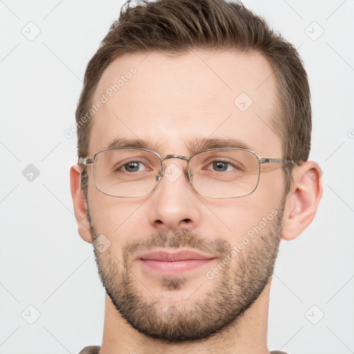 Joyful white adult male with short  brown hair and grey eyes