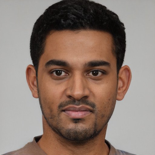 Neutral latino young-adult male with short  black hair and brown eyes