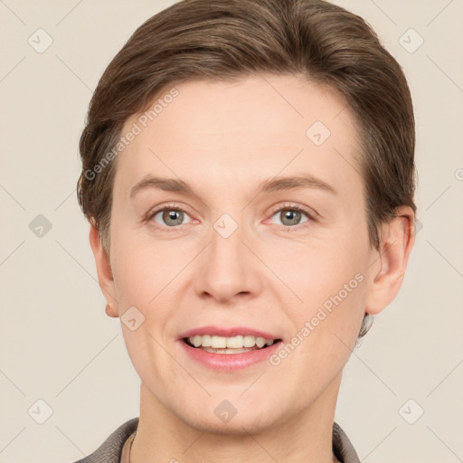 Joyful white adult female with short  brown hair and grey eyes