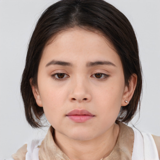 Neutral asian young-adult female with medium  brown hair and brown eyes