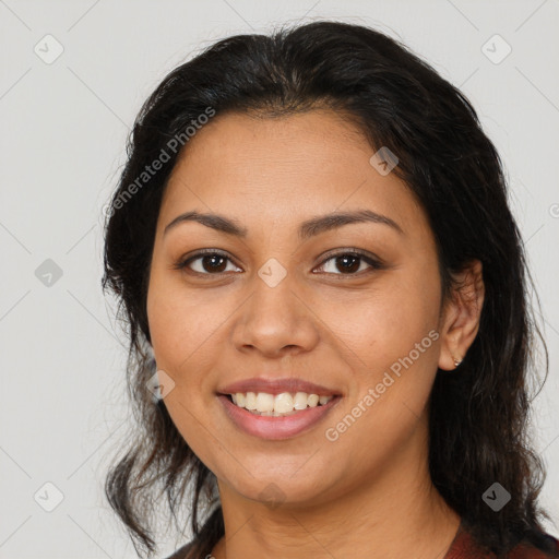 Joyful latino young-adult female with medium  brown hair and brown eyes