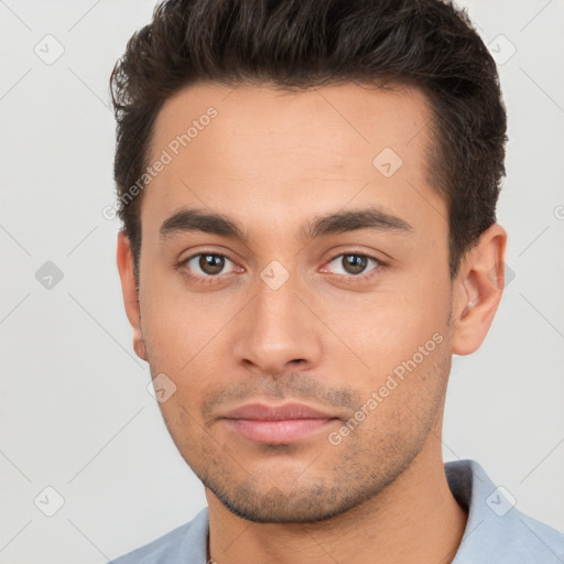 Neutral white young-adult male with short  brown hair and brown eyes