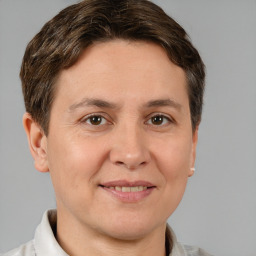 Joyful white adult female with short  brown hair and brown eyes