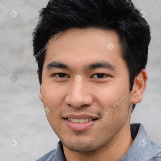 Joyful asian young-adult male with short  black hair and brown eyes