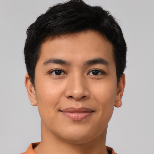 Joyful asian young-adult male with short  brown hair and brown eyes