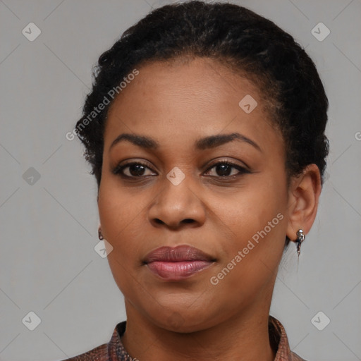 Joyful black young-adult female with medium  brown hair and brown eyes