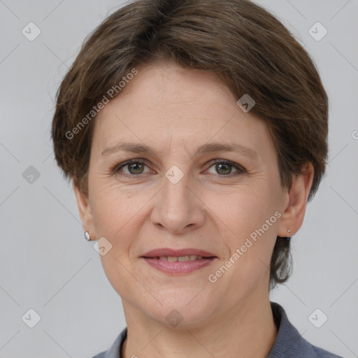 Joyful white adult female with short  brown hair and grey eyes