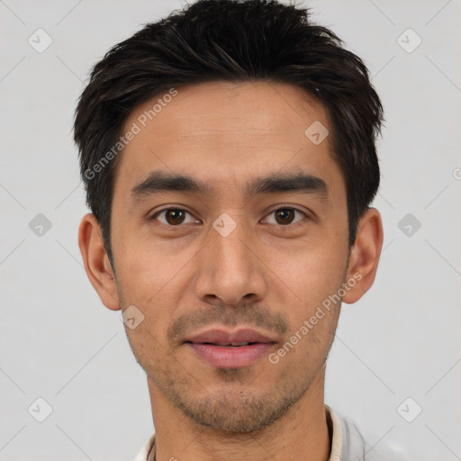 Joyful white young-adult male with short  black hair and brown eyes