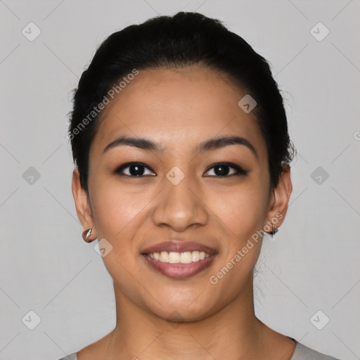 Joyful latino young-adult female with short  black hair and brown eyes