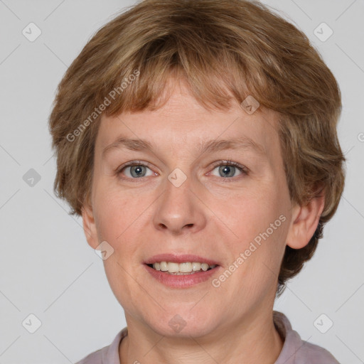 Joyful white adult female with short  brown hair and grey eyes