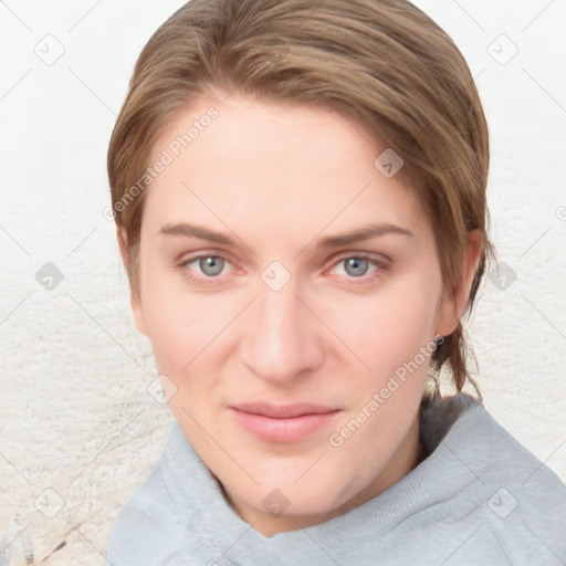 Joyful white young-adult female with short  brown hair and blue eyes