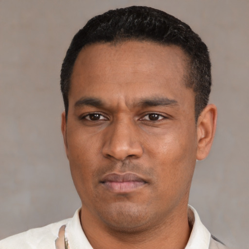 Neutral latino young-adult male with short  black hair and brown eyes