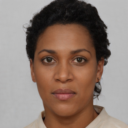 Neutral black young-adult female with short  black hair and brown eyes
