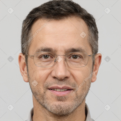 Joyful white adult male with short  brown hair and brown eyes