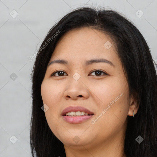 Joyful asian young-adult female with long  brown hair and brown eyes