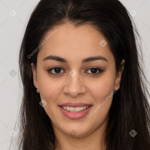 Joyful latino young-adult female with long  brown hair and brown eyes