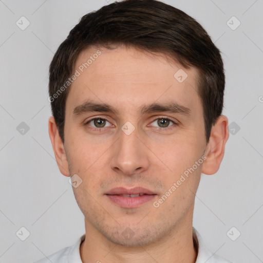 Joyful white young-adult male with short  brown hair and brown eyes