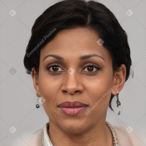 Joyful latino adult female with short  brown hair and brown eyes