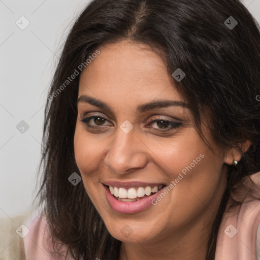 Joyful white young-adult female with long  brown hair and brown eyes