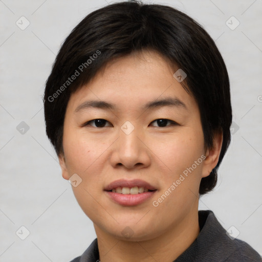 Joyful asian young-adult female with short  brown hair and brown eyes