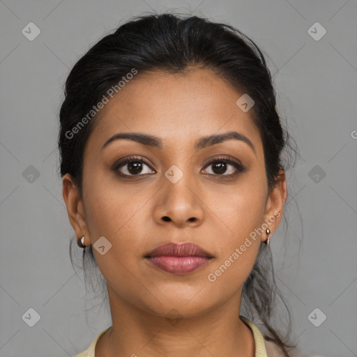 Joyful latino young-adult female with long  brown hair and brown eyes