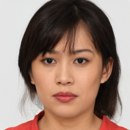 Neutral asian young-adult female with medium  brown hair and brown eyes