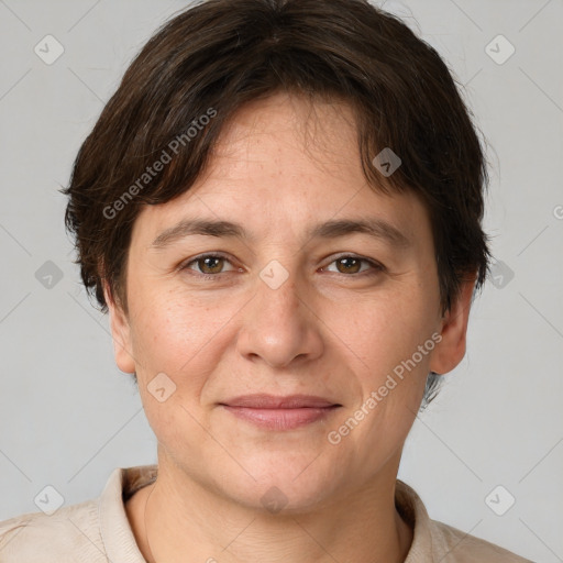 Joyful white adult female with short  brown hair and grey eyes