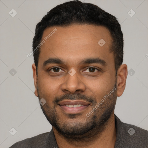 Joyful latino young-adult male with short  black hair and brown eyes