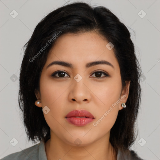 Joyful latino young-adult female with long  brown hair and brown eyes