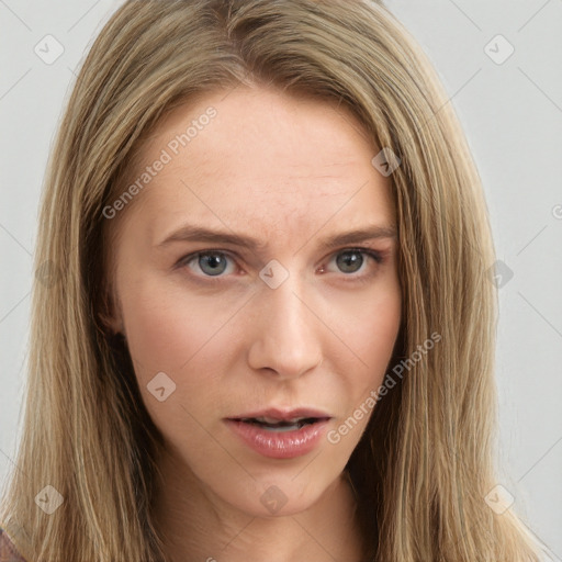 Neutral white young-adult female with long  brown hair and brown eyes