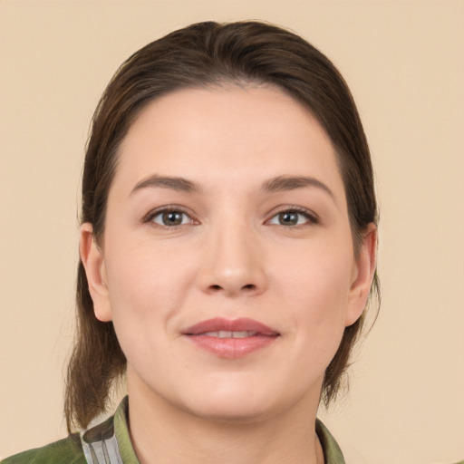 Joyful white young-adult female with medium  brown hair and brown eyes