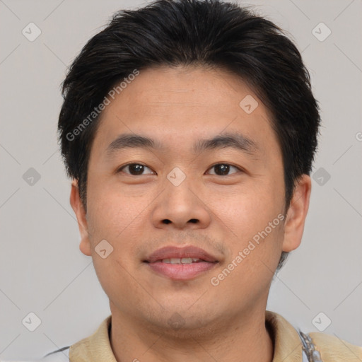 Joyful asian young-adult male with short  brown hair and brown eyes