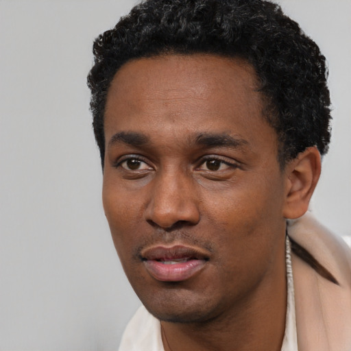 Neutral black young-adult male with short  black hair and brown eyes