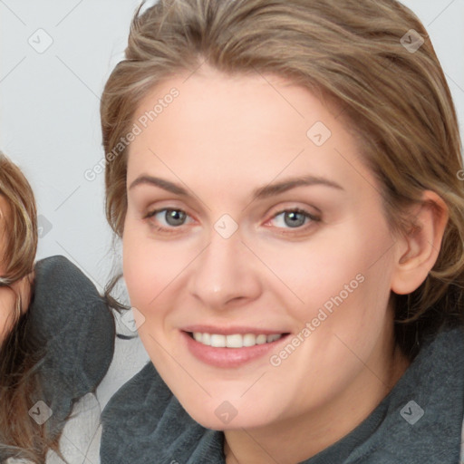 Joyful white young-adult female with medium  brown hair and blue eyes